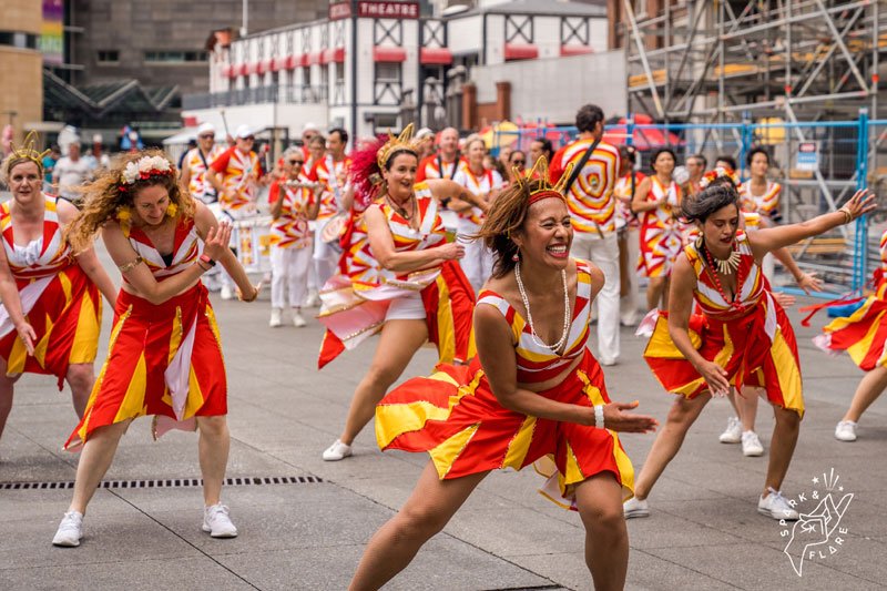costumed dancers in the street